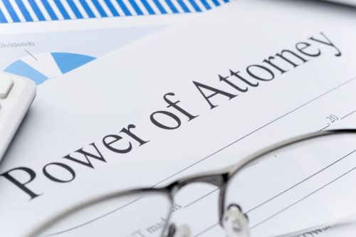 Blank power of attorney form with paperwork. Close up - guardianship power of attorney concept