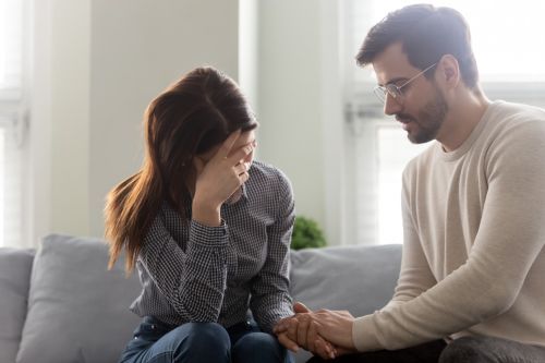 upset wife and husband showing support - collaborative divorce concept