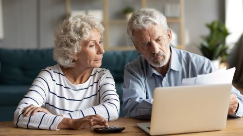 Elderly couple looking at computer - conservatorship concept